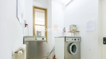 Common area with coin-operated washing machine and dryer
