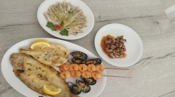 Grigliata mista di pesce e lumachini di mare
