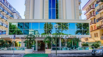 Hotel facade with large panoramic elevator