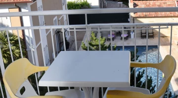 Balcony with table and chairs