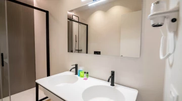Bathroom with large shower box in superior room