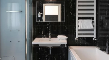 Bathroom with shower and bathtub