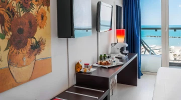 Room with balcony and electric kettle