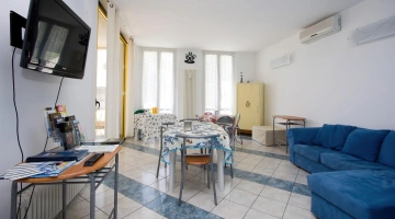 Shared living room with TV and sofas