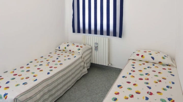 Double room with single beds in apartment