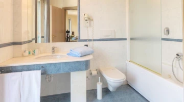 Private bathroom with tub and shower