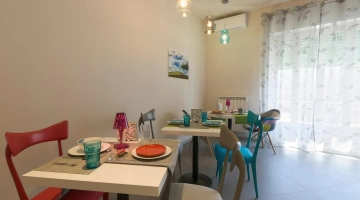 Breakfast tables in the shared kitchen