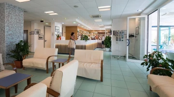 Hotel hall with reception and common lounge