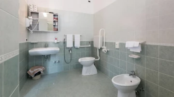 Bathroom with wall-mounted hairdryer