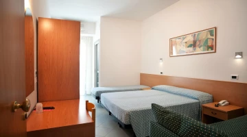 Triple room with sofa and desk