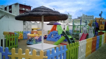 Fenced play area on the partner beach