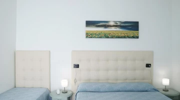 Room with double bed and single bed