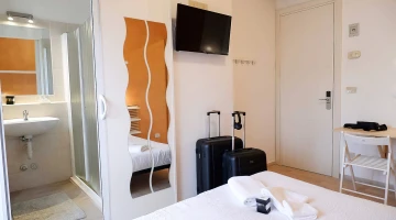 Room with bathroom and TV