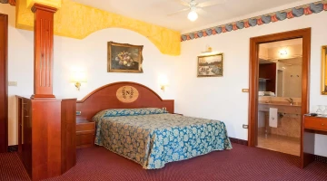 Double bed in suite with terrace