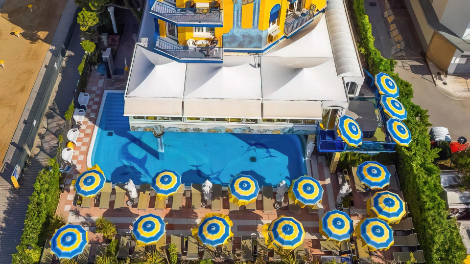 Aerial view of the exterior and swimming pool