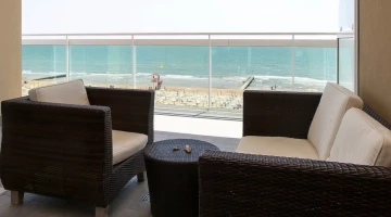 Balcony with sofa and armchair