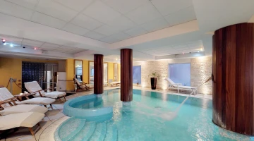 Swimming pool with sunbeds