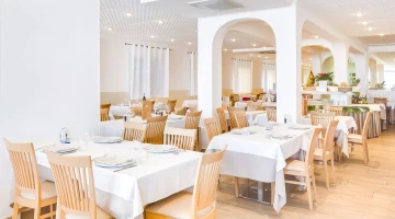 Tables set in the restaurant room
