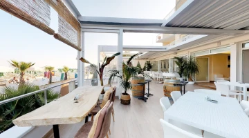 Terrace with tables on the beach