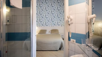 Bathroom with shower and hairdryer