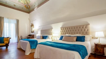 Quadruple room in the duchi d&#39;ambra apartment