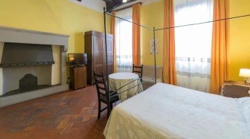 Chambre de luxe avec cheminée