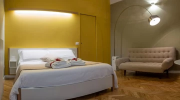 Chambre familiale de luxe avec lit double et canapé-lit