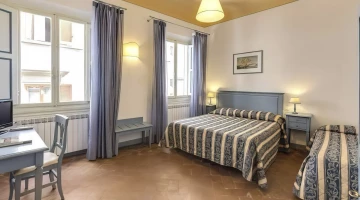 Triple room with desk and two windows