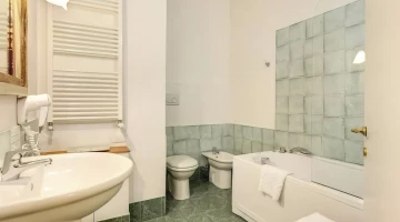 Bathroom in the double bedroom with bathtub and hairdryer