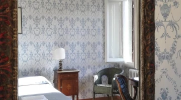 Room with armchair and desk