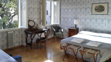 Room with double window and desk