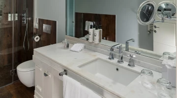 Private marble bathroom with shower
