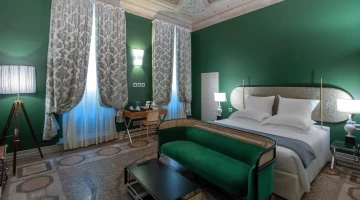 Bedroom with sofa, tea/coffee maker
