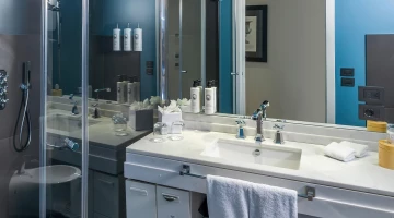Private bathroom with shower and courtesy line for guests