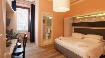Room with private bathroom, desk and TV
