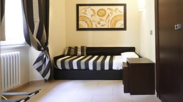 Camera tripla con divano letto