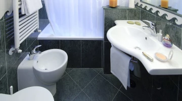 Bathroom with bathtub and amenities