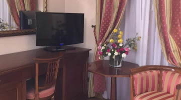 Room with desk and flat-screen TV