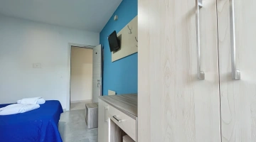 Room with desk and TV