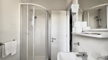 Private facilities with shower box and wall-mounted hairdryer