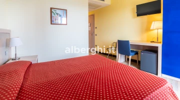 Room with desk and TV