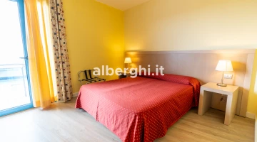 Room with luggage rack and balcony