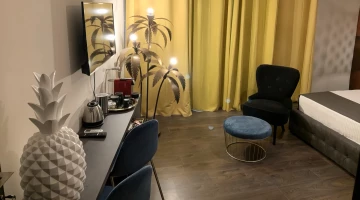 Desk and armchair in double bedroom hammam