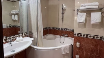 Bathroom with tub and shower