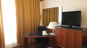 Room with a TV and desk