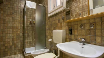 Bathroom with shower cubicle in the Family Room