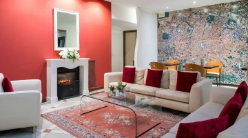   Common room with fireplace and sofas