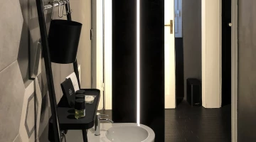 Bathroom with courtesy set in charcoal room