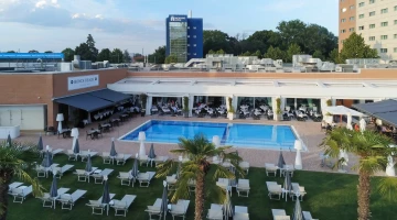 Swimming pool with sunbeds