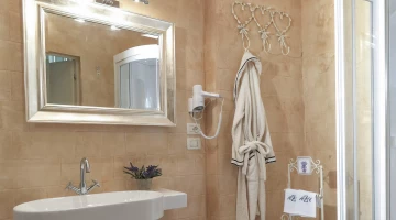 Bathroom with wall-mounted hairdryer
